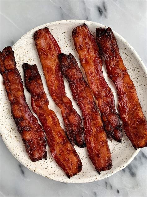How long does bacon take to cook in the oven at 400?